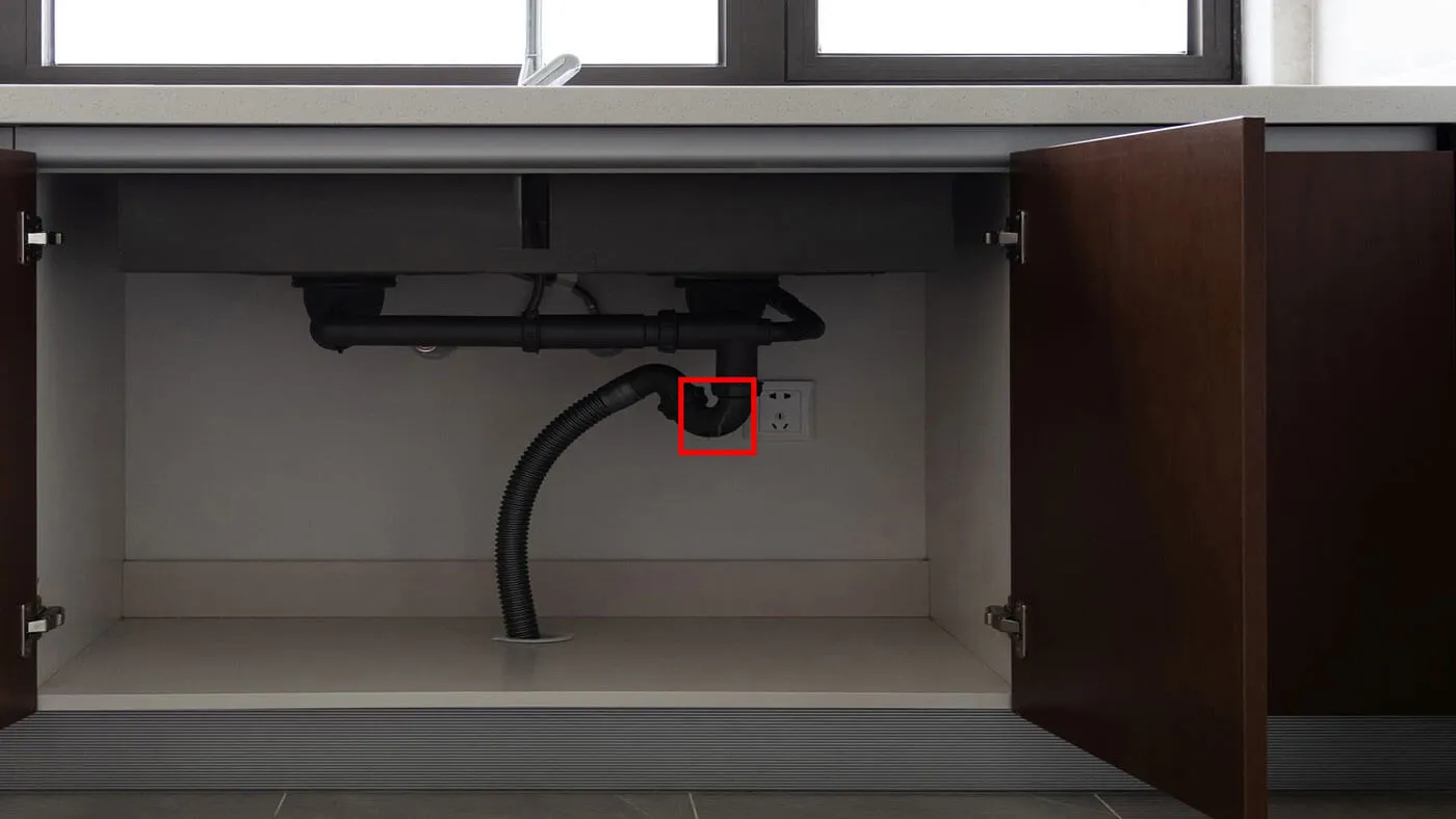 Under-sink plumbing with a marked leak